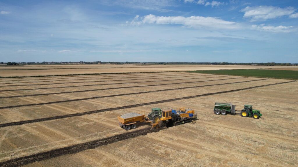 Aerial view of land drainage works in progress in Eastern England, showing heavy machinery