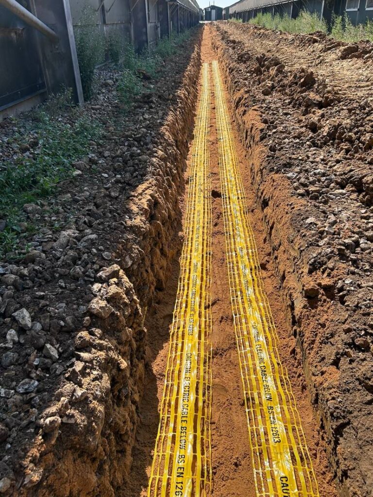 Cable trench running alongside the poultry buildings