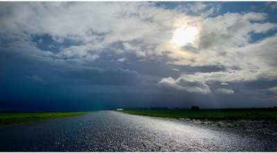 Dramatic sky over a rural landscape, illustrating the need for effective agricultural land drainage