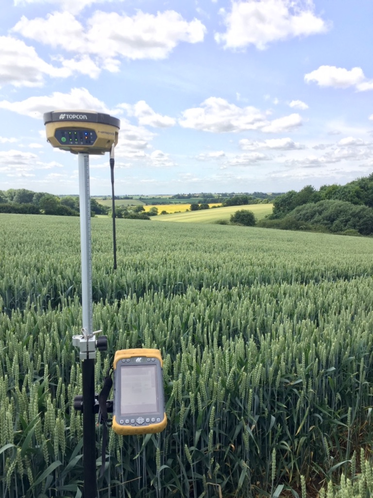 Modern GPS surveying equipment being used to record field levels before designing an agricultural land drainage scheme